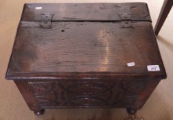 A 19th Century carved oak small coffer / coal box with carved front panel and hinged lid (possibly