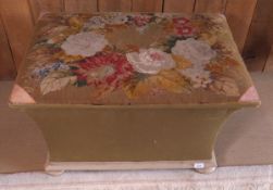 A 19th Century rectangular ottoman with waisted sides and woolwork upholstered top