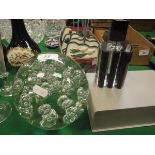 A large glass dump paperweight / doorstop with internal bubble decoration,