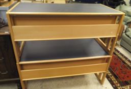 A pair of modern beech framed computer desks