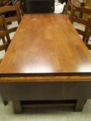 A late 20th Century mahogany drop-leaf rectangular dining table and a set of six ladder back dining