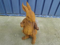 A cast metal garden ornament of "Mr Rabbit"*