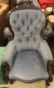 A Victorian mahogany framed salon armchair upholstered in blue velour fabric,