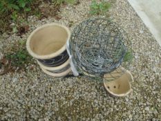 A collection of glazed garden pots together with assorted hanging baskets