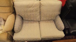 A Multiyork two-seat sofa upholstered in pale blue damask fabric,