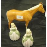 A Beswick Palomino horse figure and two Royal Doulton figurines "Penny" HN2338 (3)