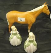 A Beswick Palomino horse figure and two Royal Doulton figurines "Penny" HN2338 (3)