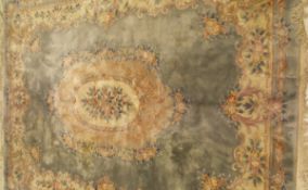 A Chinese Superwash carpet, the central medallion in cream,