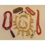 A bag of assorted jewellery to include a coral necklace,