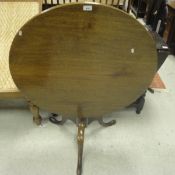 A 19th Century circular mahogany tilt top table on three cabriole legs