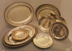 A collection of silver plated serving dishes of oval and circular form