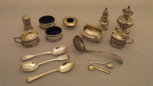 A collection of silver salts, mustard, pepper, etc, together with a pair of Georgian teaspoons,