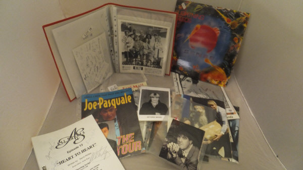 A box containing a large collection of autographed photographs and memorabilia to include Victoria