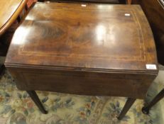 A Georgian mahogany and inlaid Pembroke table, the shaped top with butterfly flaps,