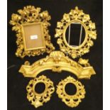 Four various Florentine gilded frames and a carved giltwood and gesso surmount CONDITION