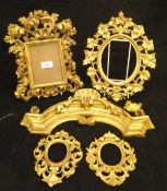 Four various Florentine gilded frames and a carved giltwood and gesso surmount CONDITION