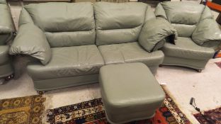 A four piece suite comprising three seat sofa,