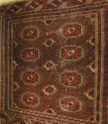 A Beluch rug, the eight central elephant foot medallions in red, cinnamon,