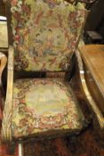 A 19th Century French beechwood framed armchair with tapestry seat and back,