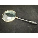 A large magnifying glass with ebonised handle*