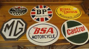 A collection of six reproduction cast iron motorcycle and petroleum signs to include "BP Motor