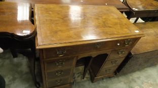 A 19th Century walnut and cross banded kneehole desk,