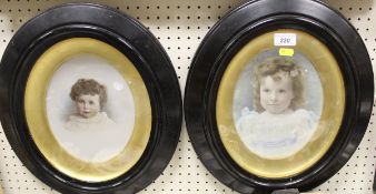 A pair of Victorian hand-coloured photographic prints of young children