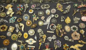 A large quantity of mid 20th Century costume brooches