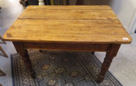 A pine breakast table on four turned legs CONDITION REPORTS The plank top is
