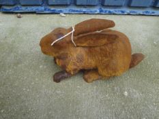 A cast metal garden ornament of a seated rabbit*