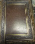 A circa 1900 gilded and embossed leather photograph album containing various family photographs