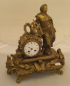 A 19th Century French gilt brass cased mantel clock decorated with Sappho with lyre and wreath,