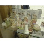 A collection of twelve Royal Albert Beatrix Potter figures to include "Peter in the gooseberry net",