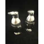 A pair of stainless steel cocktail shakers in the form of penguins*