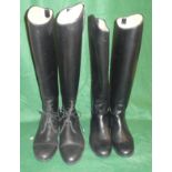 Two pairs of black riding boots