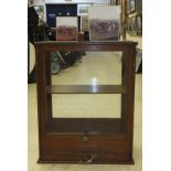 An oak framed glass display cabinet with single drawer under together with a waste paper bin and