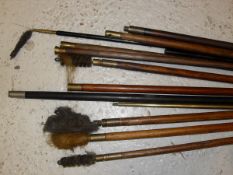A quantity of various wooden and other cleaning rods,