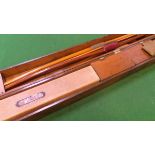 A Victorian pine long bow case and contents of five long bos to include Aldred of London bow and