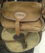 Two canvas and leather cartridge bags, one stamped 'Quality Gunslips,