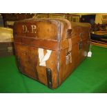 A brown leather American trunk with paper label inside 'Atkins A. Clark No.