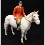 A Beswick figure of huntsman upon white horse CONDITION REPORTS Bradly crazed all