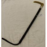 A riding crop with antler handle and white metal ferrule with a plaited leather shaft