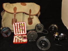 A canvas and leather fisherman's bag containing a quantity of fly cases,