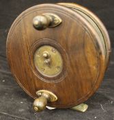 WITHDRAWN - A five inch frog back centre pin fishing reel with twin handles and heaton's latch