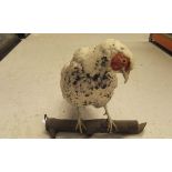 A stuffed and mounted albino Hen Pheasant set in naturalistic setting and glass fronted display