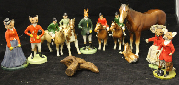 A Beswick figure of girl up on pony and various other figures on ponies and porcelain hunting