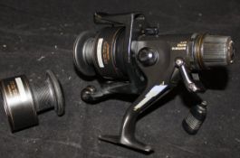 A Shimano, SGT, 6000 bait runner reel complete with spare spool,