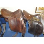 A Haynes of Cirencester dressage saddle together with another similar and a R.M.