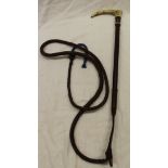 A riding crop with antler handle and painted ferrule with plaited shaft and thong