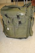 A Normark "Pioneer" carp fisher's rucksack containing an assortment of fishing luggage to include